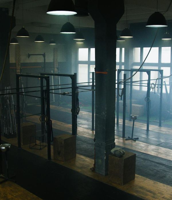 Minimalist training space with natural light and simple equipment.